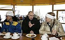In the cafe at the Krasnaya Polyana ski resort. With Vladimir Makarenkov, deputy Director of a Gazprom affiliate involved in the construction, and athlete Svetlana Gladysheva.