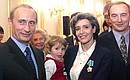 A ceremony to present Russian state awards to French astronauts. President Putin and Brigadier General Jean-Pierre Haignere with his wife, Claudie Andre-Deshays.