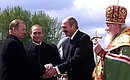 Vladimir Putin with presidents Leonid Kuchma of Ukraine (to the left) and Alexander Lukashenko of Belarus, and the Patriarch of Moscow and All Russia Alexy II in Sts. Peter and Paul\'s Church after Easter liturgy.