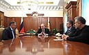 Meeting with leaders of the Republic of Crimea and the city of Sevastopol. From left to right: Chairman of the State Council of the Republic of Crimea Vladimir Konstantinov, Vladimir Putin, Prime Minister of the Republic of Crimea Sergei Aksyonov and Chairman of the Coordinating Council for the establishment of the Sevastopol municipal administration Alexei Chaly.
