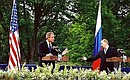 President Putin at a joint press conference with U.S. President George Bush.