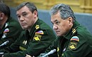 At a meeting with Defence Ministry officials and representatives of defence companies. Defence Minister Sergei Shoigu (right) and Chief of the General Staff of Russia’s Armed Forces Valery Gerasimov.