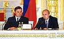 President Putin and Prime Minister Kasyanov at a State Council session on modernisation of the Russian educational system.