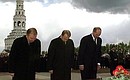 Laying flowers at the monument of St. Vladimir the Prince Equal-to-the-Apostles with presidents Leonid Kuchma of Ukraine and Alexander Lukashenko of Belarus.