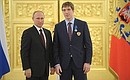 С нападающим сборной России по хоккею Николаем Кулёминым.
