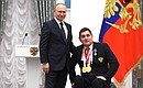 Presenting state decorations to winners of the 2020 Summer Paralympic Games in Tokyo. Two-time Paralympic champion in wheelchair fencing Alexander Kuzyukov receives the Order of Friendship. Photo: RIA Novosti