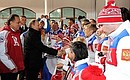 With members of the Russian Paralympics team after the Russian Federation flag-raising ceremony at the Paralympic Mountain Village. Sports Minister Vitaly Mutko, left.