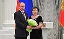 At a presentation of state decorations. Teacher of the Aga-Khangil School (Trans-Baikal Territory) Rimma Dondokova has received the honorary title of Honoured Teacher of the Russian Federation.