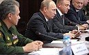 At a meeting on developing the higher military education system. Defence Minister Sergei Shoigu (left).