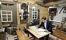 Dmitry Medvedev signed the honoured guest book in the Crafts Museum at the Palace of Creativity for Children and Teenagers.