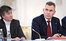 Presidential Commissioner for Children's Rights Pavel Astakhov (right) and director of Moscow gymnasium No. 1514 Anna Belova at State Council meeting on improving the general education system.