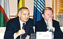 Presidents Islam Karimov of Uzbekistan and Leonid Kuchma (right) of Ukraine during a news conference of CIS leaders after their summit.