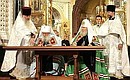 The Act on Canonical Communion of the Moscow Patriarchate and the Russian Orthodox Church Abroad is signed by First Hierarch of the Russian Orthodox Church Abroad Metropolitan Laurus (left) and Patriarch of Moscow and all-Russia Aleksei II.