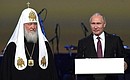 At the plenary session of the World Russian People's Council. With Patriarch Kirill of Moscow and All Russia. Photo: RIA Novosti