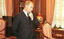 President Putin before a meeting with Governor of Taimyr Alexander Khloponin, Alexander Uss, Speaker of the Krasnoyarsk Legislature, and Acting Governor of Krasnoyarsk Nikolai Ashlapov.