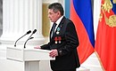 Ceremony for presenting state decorations. Loading crane operator at Magnitogorsk Iron and Steel Works Valery Batin awarded the Order of Friendship.