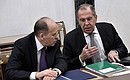 Before a meeting with permanent members of the Security Council. Director of the Federal Security Service Alexander Bortnikov (left) and and Foreign Minister Sergei Lavrov.