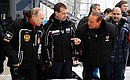With Prime Minister Vladimir Putin and Silvio Berlusconi during test runs on the sledding and bobsleigh track.