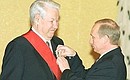 Boris Yeltsin being awarded the Order of Merit for the Fatherland 1st Class.