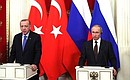 Vladimir Putin and Recep Tayyip Erdogan giving statements to the press after Russian-Turkish talks.