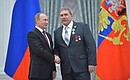 Control post operator at the Magnitogorsk Iron and Steel Works Anatoly Lukin is awarded the Order of Friendship.