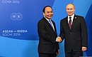 With Prime Minister of Vietnam Nguyen Xuan Phuc. Photo: russia-asean20.ru