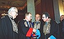 President Putin receiving a mantle and ribbon of honorary doctorate at Athens University.