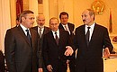 President Putin with Belarusian President Alexander Lukashenko (right) and Russian Prime Minister Mikhail Kasyanov (left) at the end of a meeting of the Supreme State Council of Russia and Belarus.