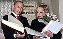 Vladimir Putin presented Galina Volchek, the Sovremennik Theatre\'s artistic director, with a book, “A History of the Theatre in Photographs.”