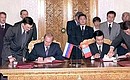 President Putin and Mongolian President Natsagiyn Bagabandi signing a joint declaration.