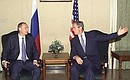 President Putin speaking with US President George W. Bush.