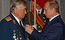 President Putin presenting the Order of Friendship to veteran and Hero of the Soviet Union Mikhail Bulatov, who fought in the Battle of the Kursk Bulge.