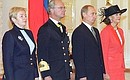Vladimir and Lyudmila Putina welcoming King Carl XVI Gustav and Queen Silvia of Sweden.