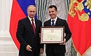A letter of recognition for contribution to the development of Russia football and high athletic achievements is presented to Russia national football team coach Paulino Granero.