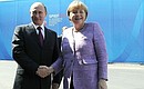 With Federal Chancellor of Germany Angela Merkel before the plenary session at the St Petersburg International Economic Forum.