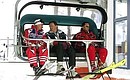 President Putin with Austrian Federal Chancellor Wolfgang Schuessel (centre) rising in a cable car at the ski resort of St Christoph.