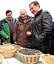 Visiting Rodina farm. With Prime Minister Vladimir Putin (centre) and farm director Viktor Orlov.