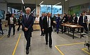 Vladimir Putin tours the workshops of the Technograd recreational and educational complex at VDNKh. With Moscow Mayor Sergei Sobyanin (left).