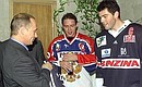 President Vladimir Putin with Russian ice hockey team captain Pavel Bure and Czech captain Jaromir Jagr at the Russian-Czech Spartak Cup match.