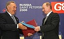 President Vladimir Putin of Russia and President Nursultan Nazarbayev of Kazakhstan sign joint declaration on expanded cooperation as regards the development of the Karachaganak deposit at their bilateral meeting during the G8 summit in St. Petersburg.