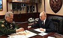 With Defence Minister Sergei Shoigu. Photo: Alexei Danichev, RIA Novosti